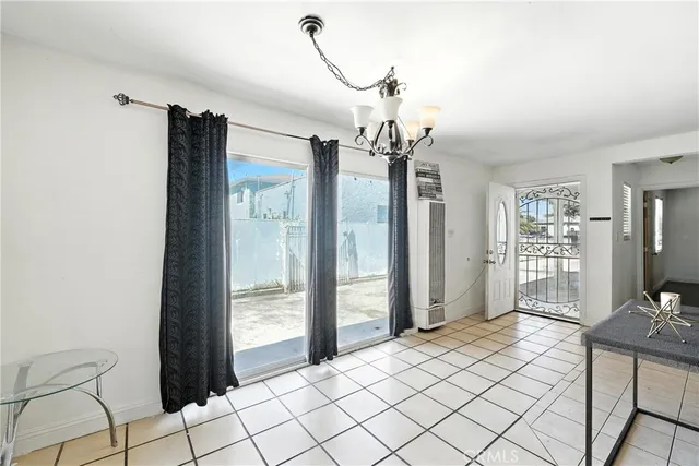 a view of a living room and kitchen with furniture