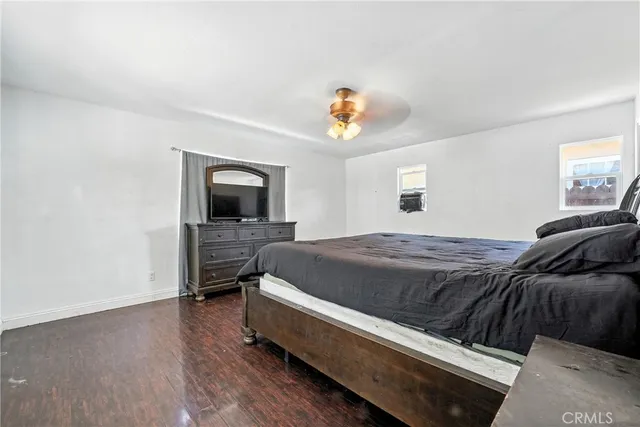 a bed room with a bed and a chair