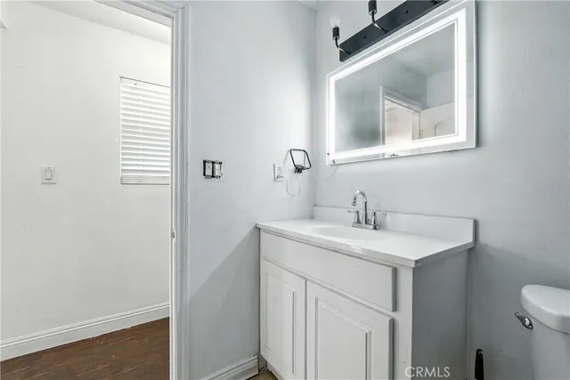 a bathroom with a toilet and a sink