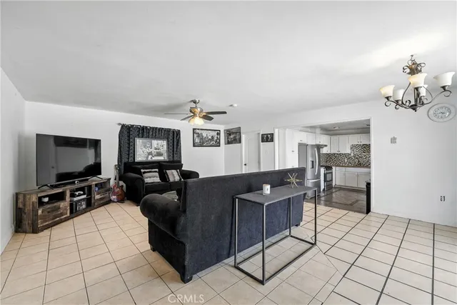 a view of a room with window and chandelier