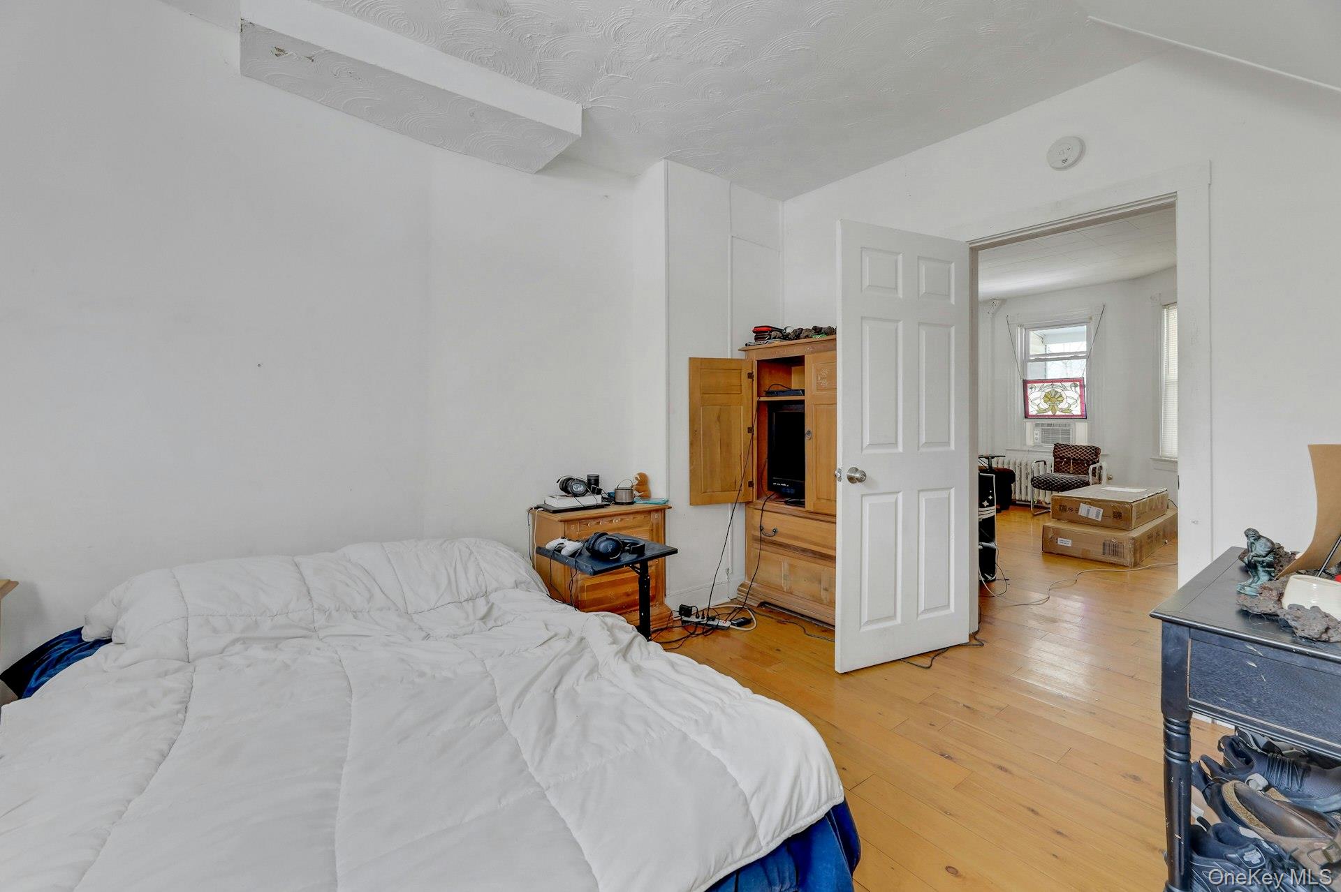 65 Lake Road Valley Cottage, NY 10989 - Photo 15 of 33 a bedroom with furniture and a wooden floor
