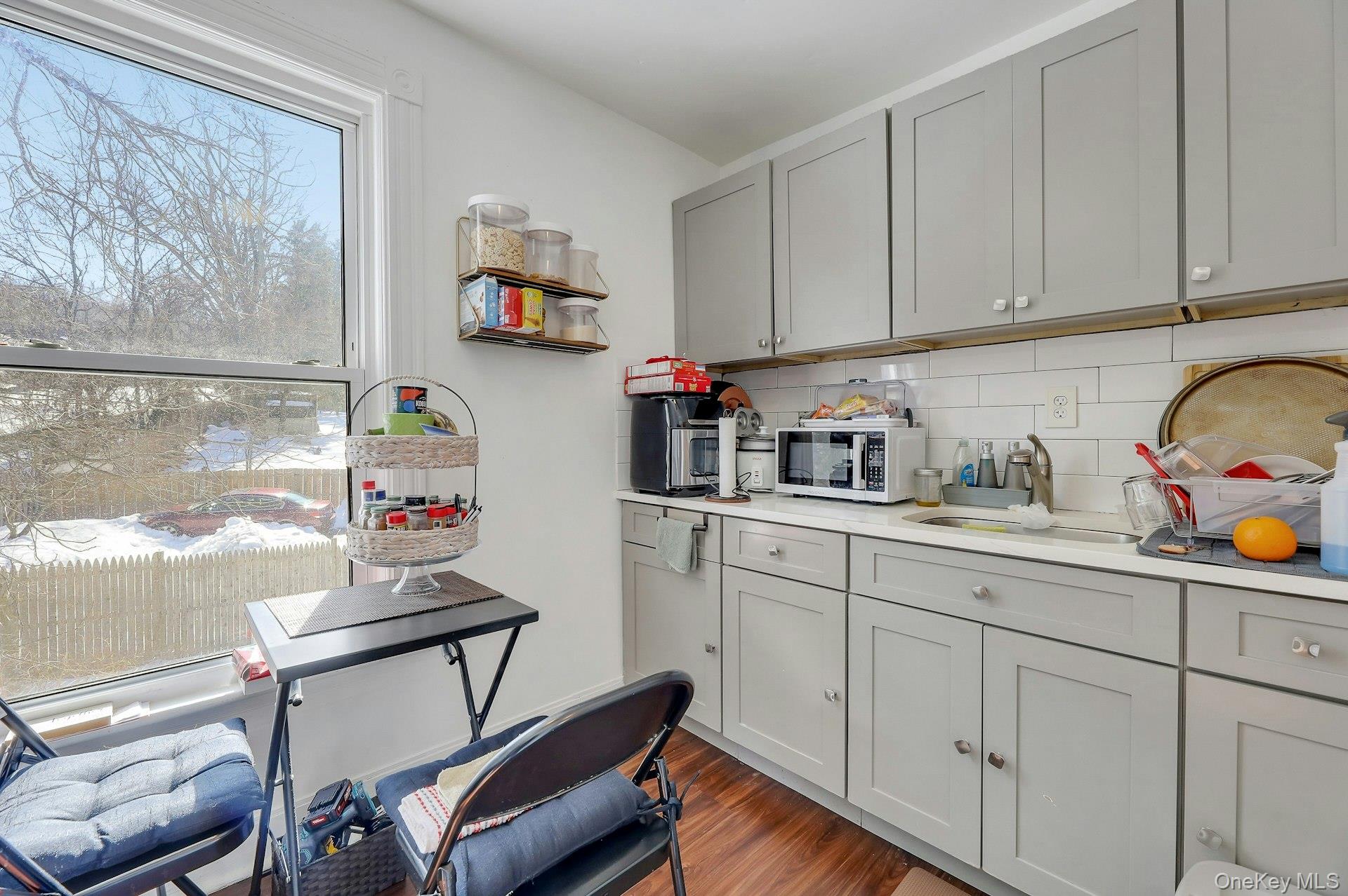 65 Lake Road Valley Cottage, NY 10989 - Photo 26 of 33 a kitchen with stainless steel appliances granite countertop a sink stove and cabinets