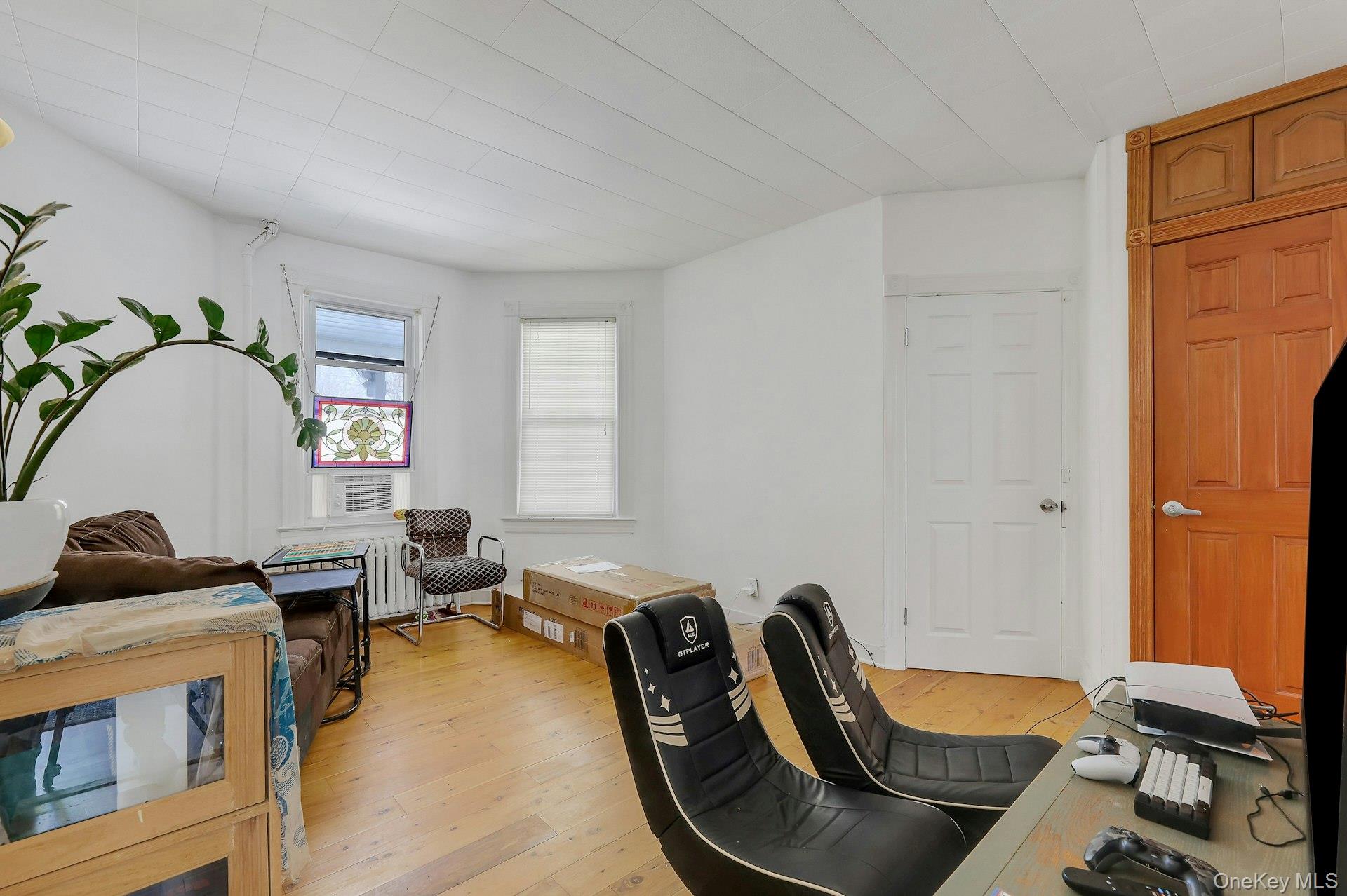65 Lake Road Valley Cottage, NY 10989 - Photo 7 of 33 a room with furniture and a window