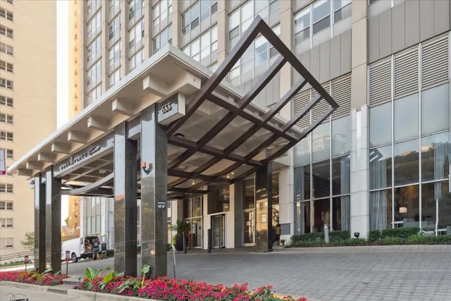 a large white kitchen with wooden floors and white walls