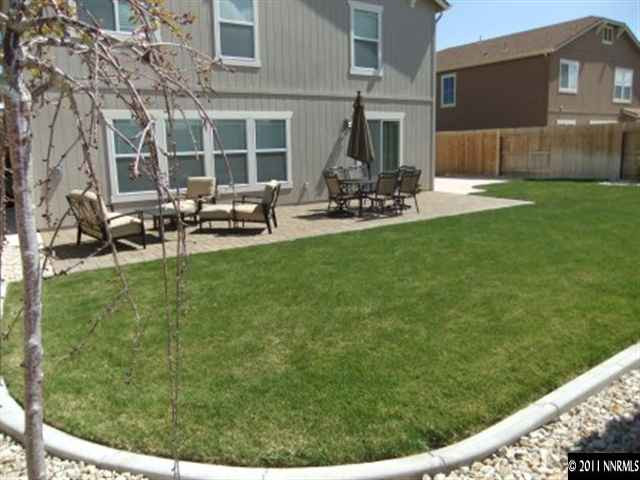 8967 Grisom Way Reno, NV 89506 - Photo 12 of 12 a view of a backyard with sitting area
