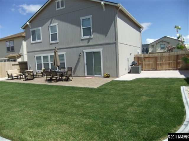 8967 Grisom Way Reno, NV 89506 - Photo 5 of 12 a view of a house with a yard