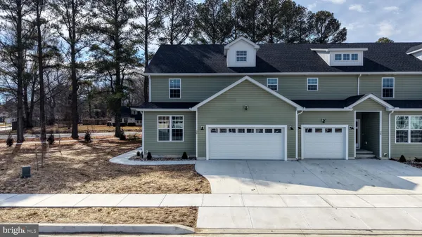 a view of a car park in front of house