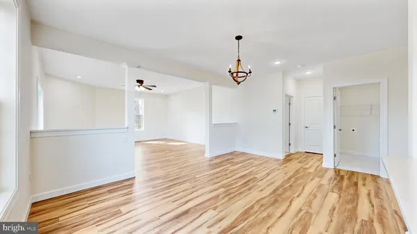 a view of kitchen with furniture and wooden floor