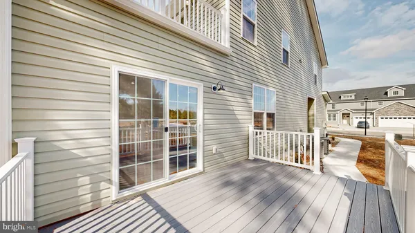 a view of an empty room with stairs