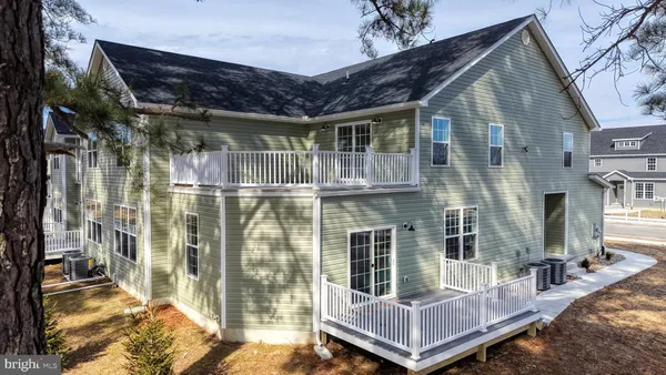 a view of house with a large window and wooden floor