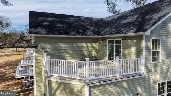 a view of a balcony with wooden floor