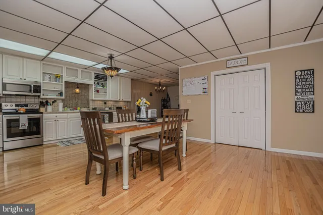 a kitchen with stainless steel appliances a stove a refrigerator and cabinets