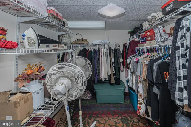 a view of a dining room with furniture and window