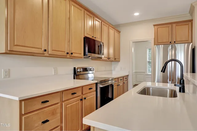 a kitchen with a sink and a microwave oven