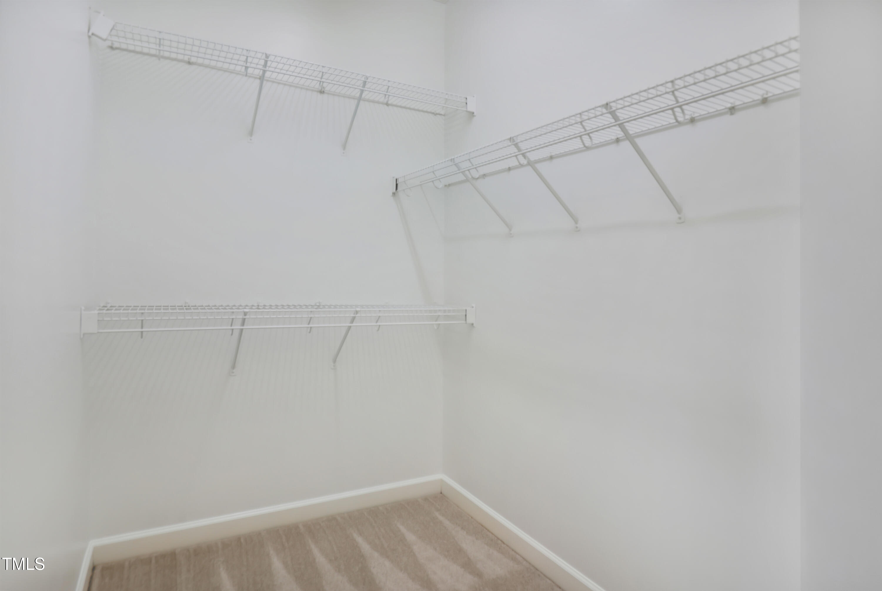 814 Cotton Exchange Court Raleigh, NC 27608 - Photo 22 of 35 a view of a room with racks on the wall