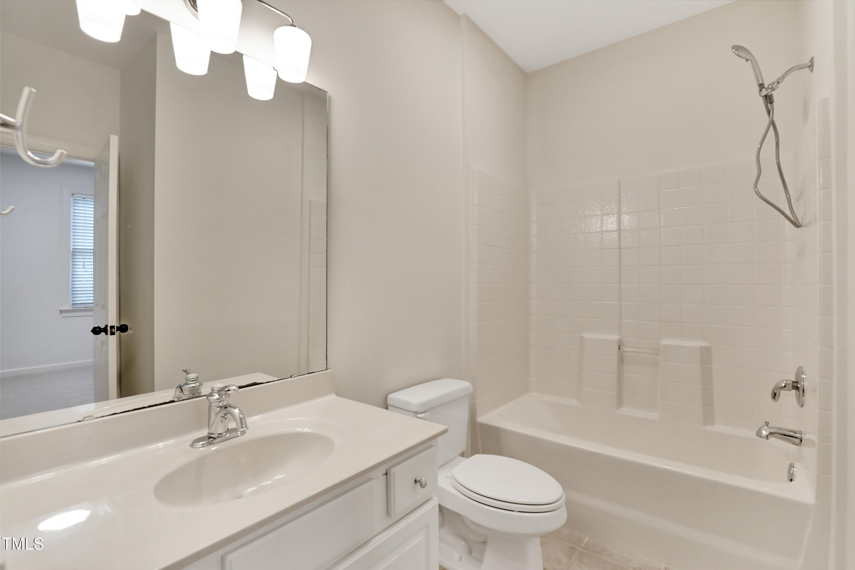 814 Cotton Exchange Court Raleigh, NC 27608 - Photo 24 of 35 a bathroom with a sink a toilet and shower