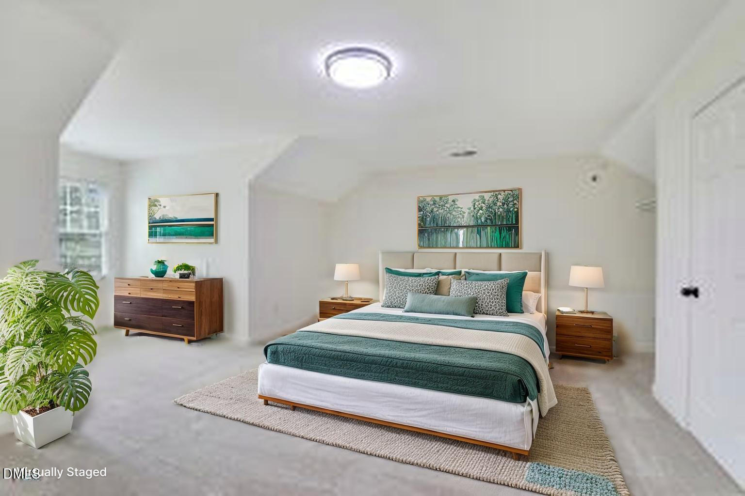 814 Cotton Exchange Court Raleigh, NC 27608 - Photo 27 of 35 a bedroom with a bed and a couch