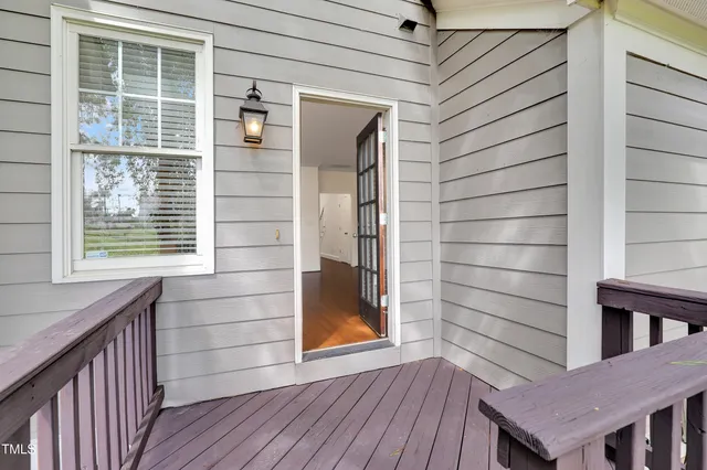a view of a chairs and tables in a patio