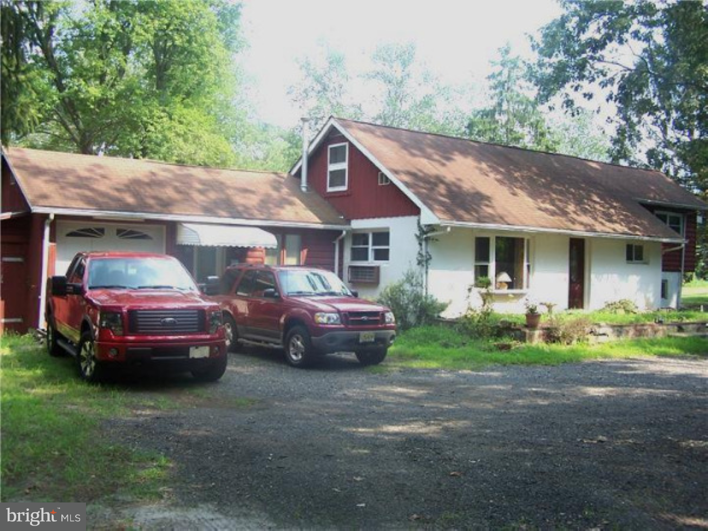 573 Tabernacle Road Medford, NJ 08055 - Photo 17 of 22 a front view of a house with a garden and parking space