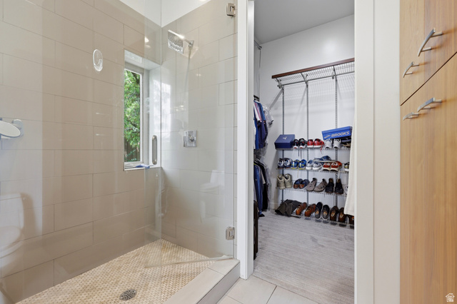1389 Millbrook Way Bountiful, UT 84010 - Photo 36 of 74 Glass-enclosed shower with subway tile surround, mosaic tile floor, and a window for natural light