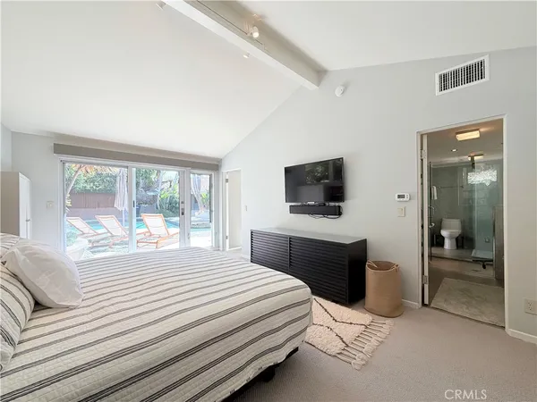 a very nice looking room with a large window and a chandelier