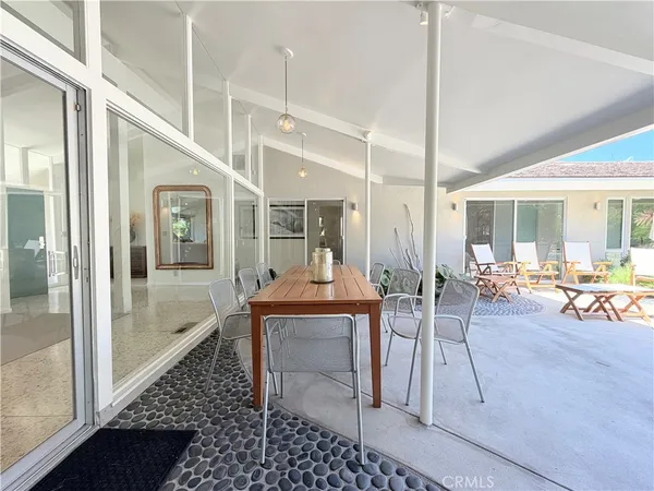 a view of a swimming pool with a patio