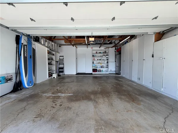 a front view of a house with a yard and a garden