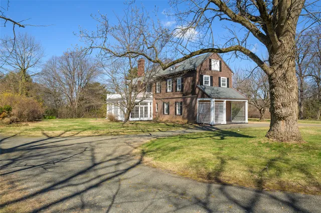 a view of a house with swimming pool and a yard
