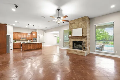 a view of a kitchen with a stove cabinets and a kitchen