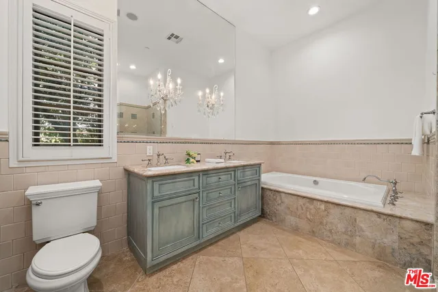 a bathroom with a toilet and a sink