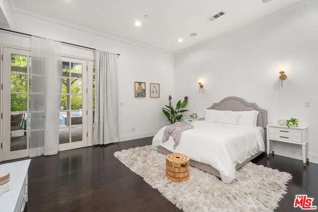 a bathroom with a toilet sink and shower