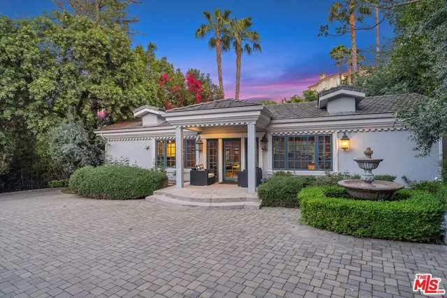 an aerial view of a house with a garden