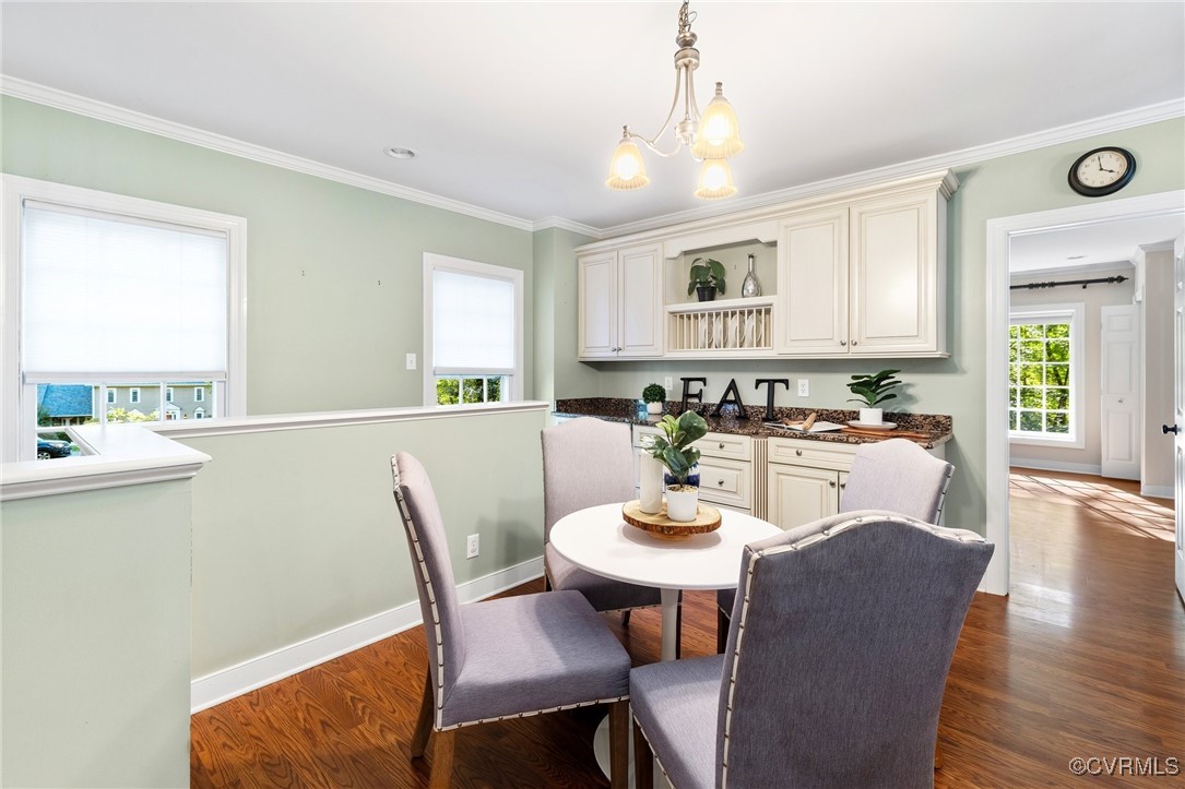 17 Dahlgren Road Richmond, VA 23238 - Photo 13 of 49 a view of a dining room with furniture window and wooden floor