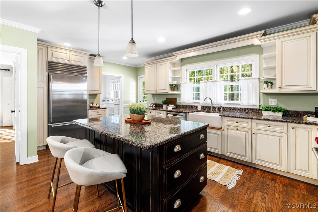 17 Dahlgren Road Richmond, VA 23238 - Photo 14 of 49 a kitchen with granite countertop a sink a counter space appliances and cabinets