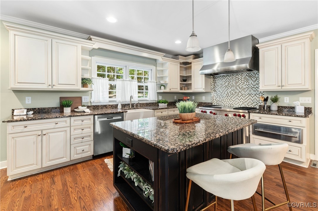 17 Dahlgren Road Richmond, VA 23238 - Photo 16 of 49 a kitchen with stainless steel appliances granite countertop a stove a sink dishwasher and white cabinets with wooden floor