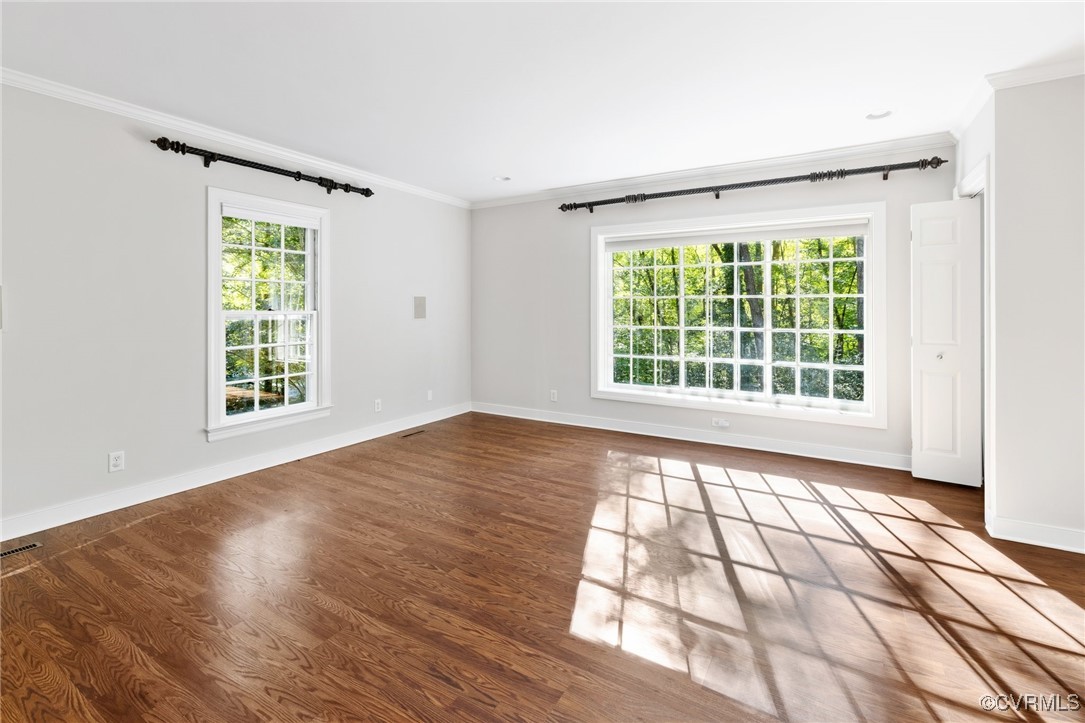 17 Dahlgren Road Richmond, VA 23238 - Photo 21 of 49 a view of an empty room with wooden floor and a window