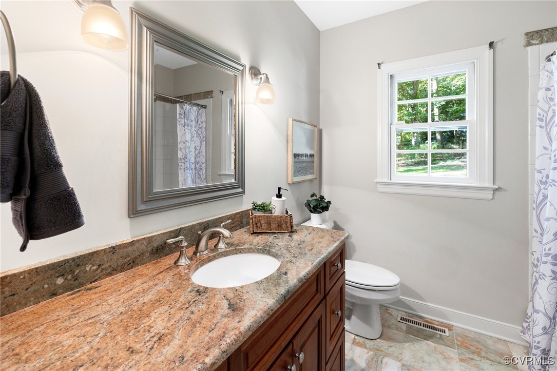 17 Dahlgren Road Richmond, VA 23238 - Photo 22 of 49 a bathroom with a granite countertop sink toilet and mirror