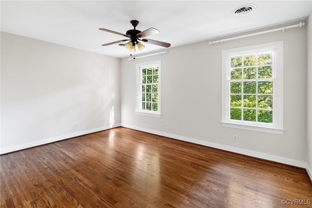 17 Dahlgren Road Richmond, VA 23238 - Photo 24 of 49 a view of an empty room with wooden floor and a window