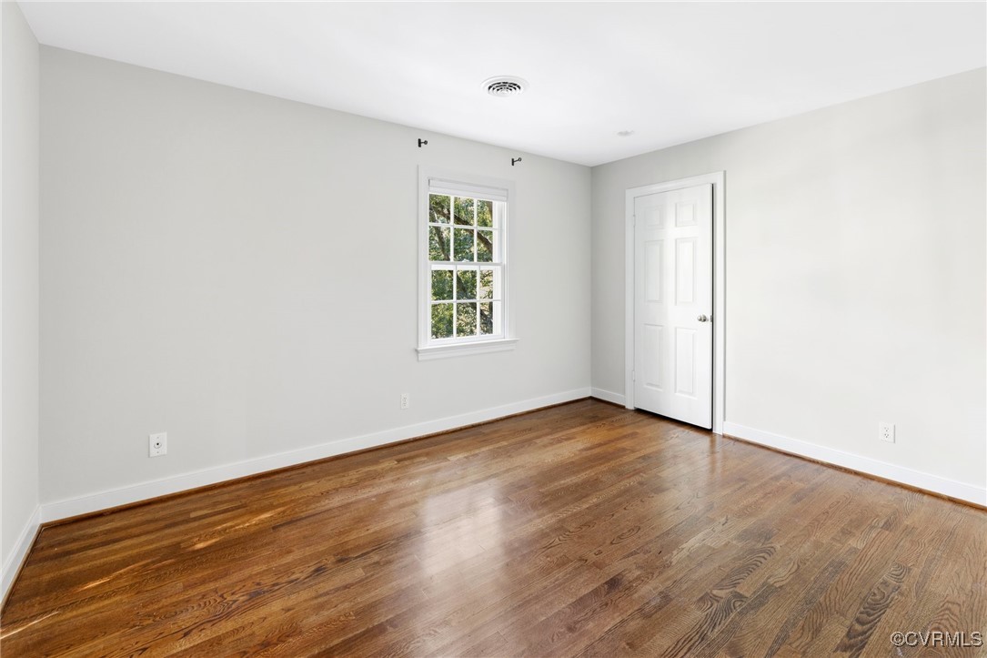 17 Dahlgren Road Richmond, VA 23238 - Photo 25 of 49 an empty room with wooden floor and windows