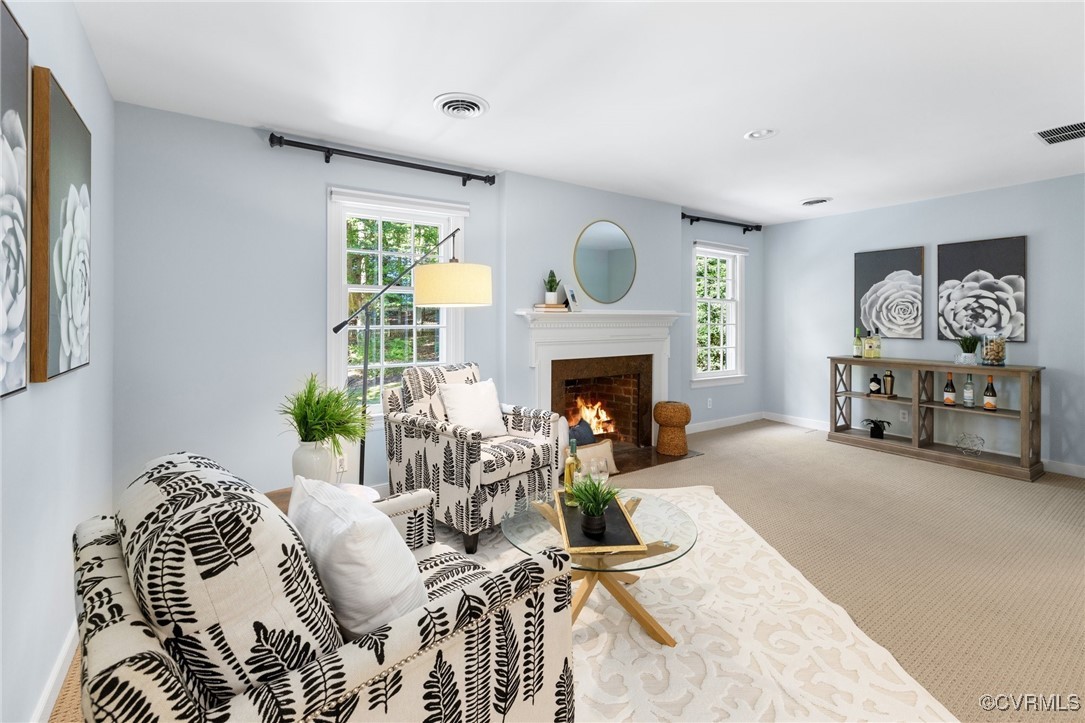 17 Dahlgren Road Richmond, VA 23238 - Photo 32 of 49 a living room with furniture and a fireplace