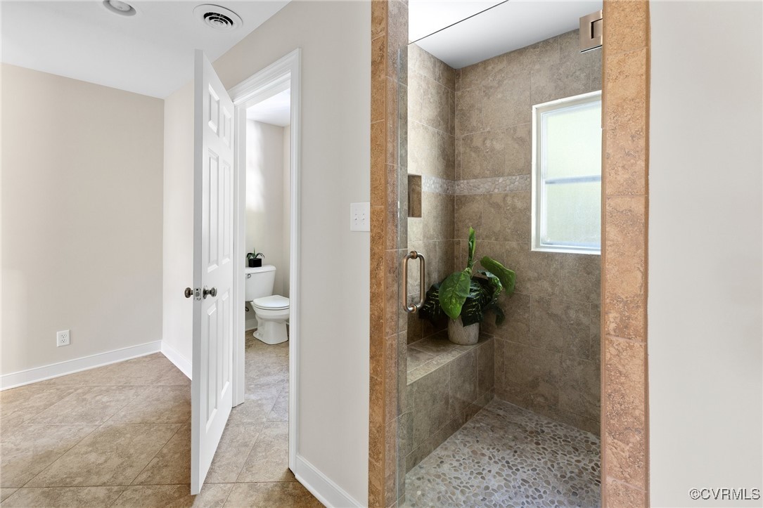 17 Dahlgren Road Richmond, VA 23238 - Photo 35 of 49 a view of a hallway with potted plants in front of door