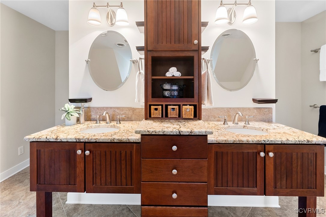 17 Dahlgren Road Richmond, VA 23238 - Photo 36 of 49 a bathroom with a granite countertop double vanity and a mirror