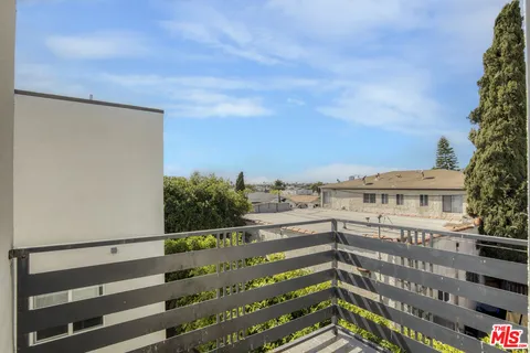 a view of a balcony with an outdoor space