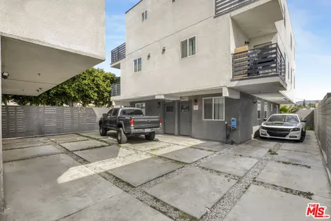 a view of a car park in front of house
