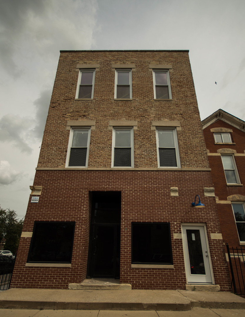 2115 South Wood Street, Unit 2S Chicago, IL 60608 - Photo 1 of 9 a front view of a house