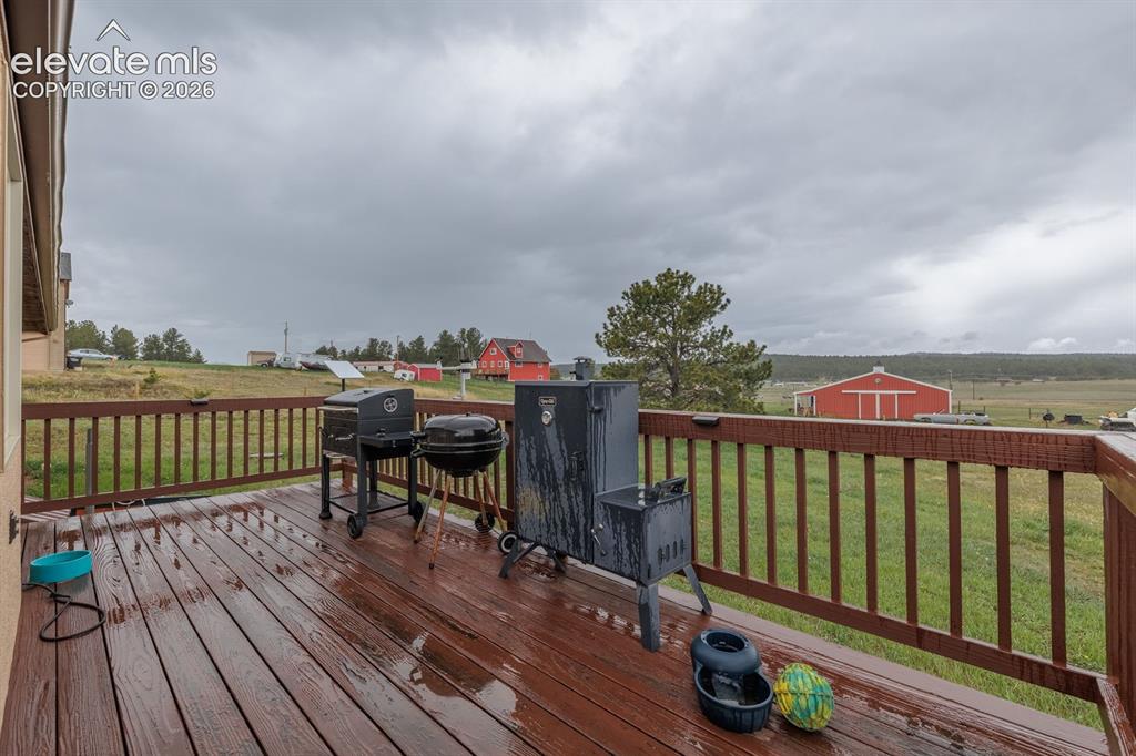 471 Due S Road Florissant, CO 80816 - Photo 4 of 35 a balcony with wooden floor table and chairs