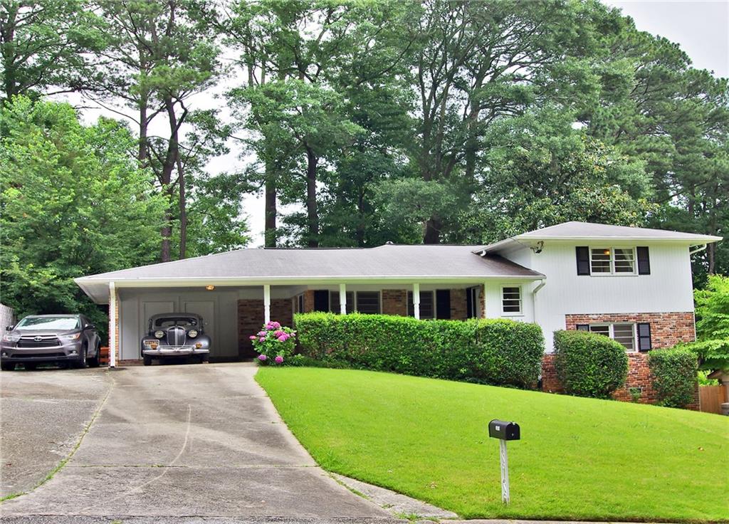 2961 Appling Drive Chamblee, GA 30341 - Photo 1 of 1 a front view of a house with a garden