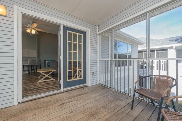 a view of a balcony with furniture