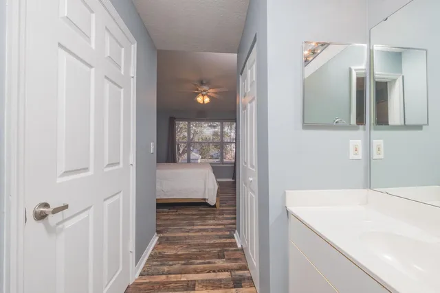 a en suite bathroom with a sink and mirror