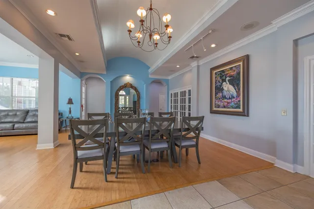 a view of a house with backyard sitting area and garden